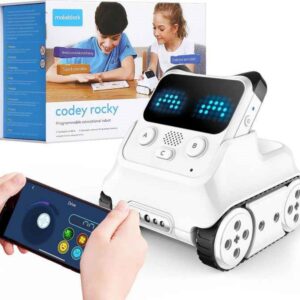 The image shows the Makeblock Codey Rocky, a programmable educational robot. The robot is white with black treads, and features a small screen displaying LED lights. The packaging shows children interacting with the robot and a smartphone app interface is visible, suggesting remote control capabilities. The box indicates it's programmable and educational.