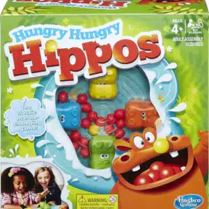 The image shows a box of the board game "Marble-Swallowing Hippo". The box is blue and yellow, and features an illustration of four hippos playing the game. The dimensions of the box are also shown in the image: 27.5 cm high, 10.5 cm wide, and 26.5 cm deep. The box indicates that the game is for family fun and includes English instructions.